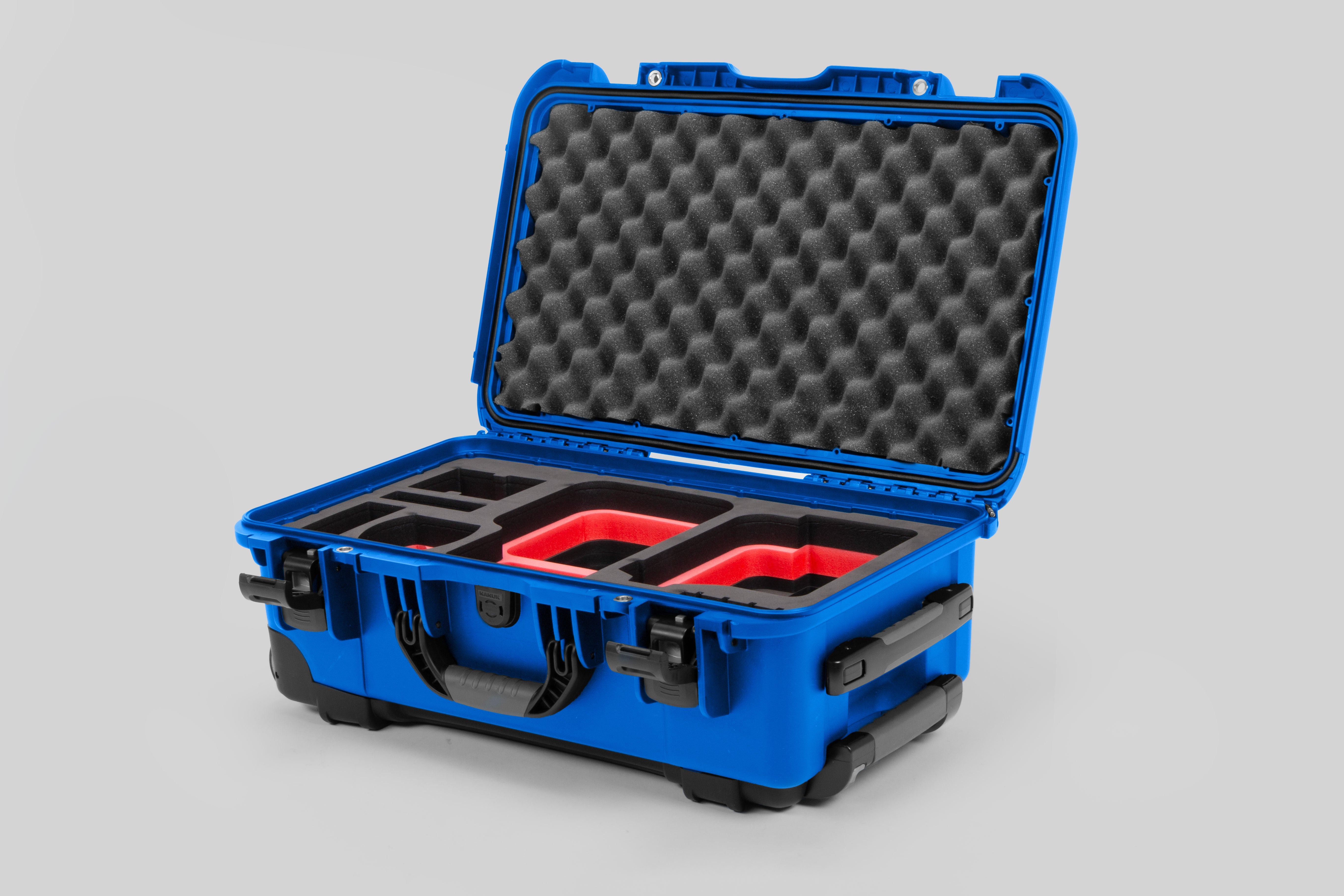 Angle view of Blue Color Canon C400 Camera Carry-on Case and Red Layer Custom Foam Insert