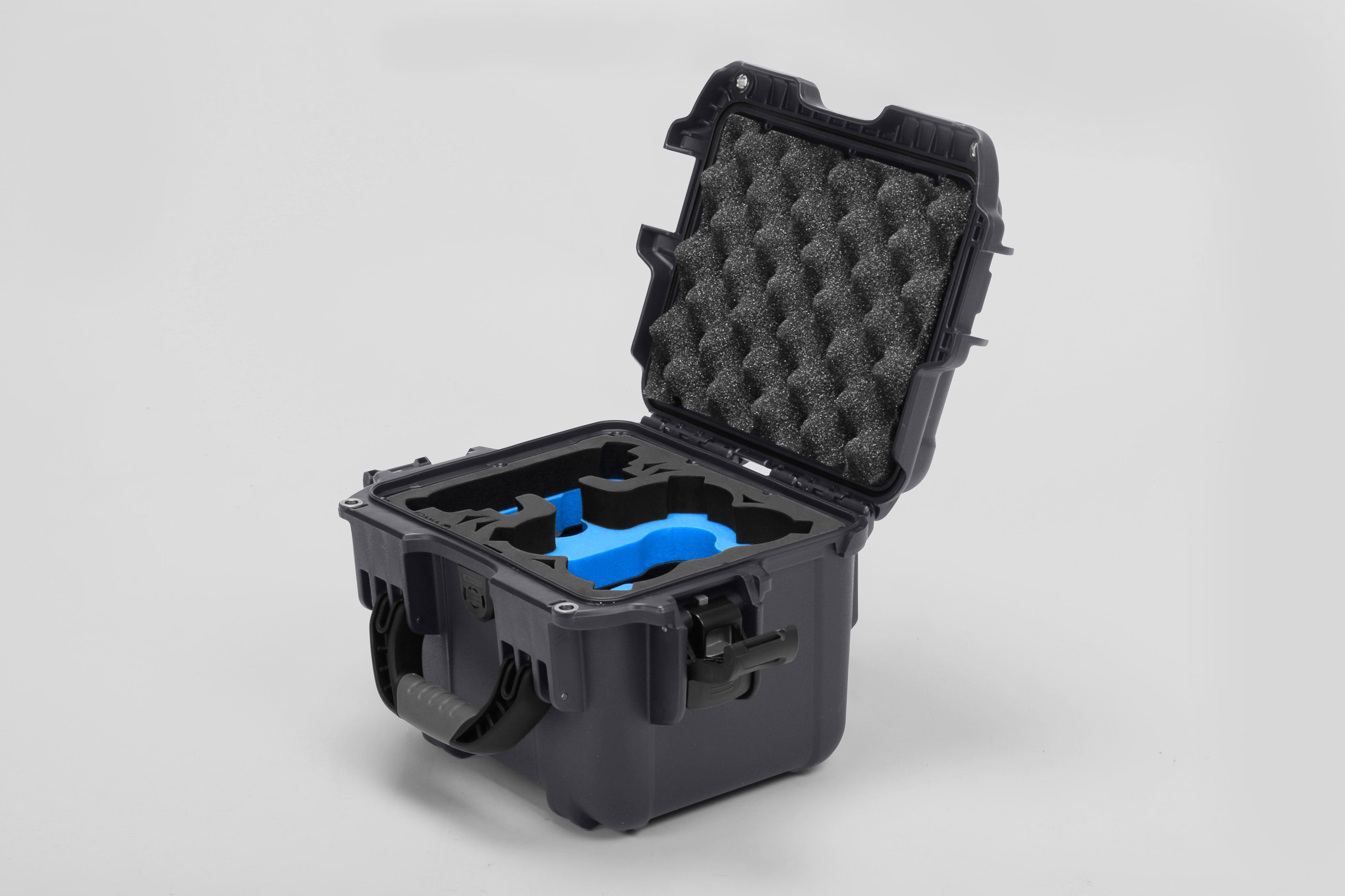 Angled view of DJI Neo Graphite Color Adventure Ready Compact Waterproof Carry-on Case and Custom Foam Insert with a Blue Layer for DJI Neo