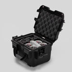 Angled view of DJI Neo Black Color Adventure Ready Compact Waterproof Carry-on Case and Custom Foam Insert with a Red Layer, holding the DJI Neo Fly More Combo