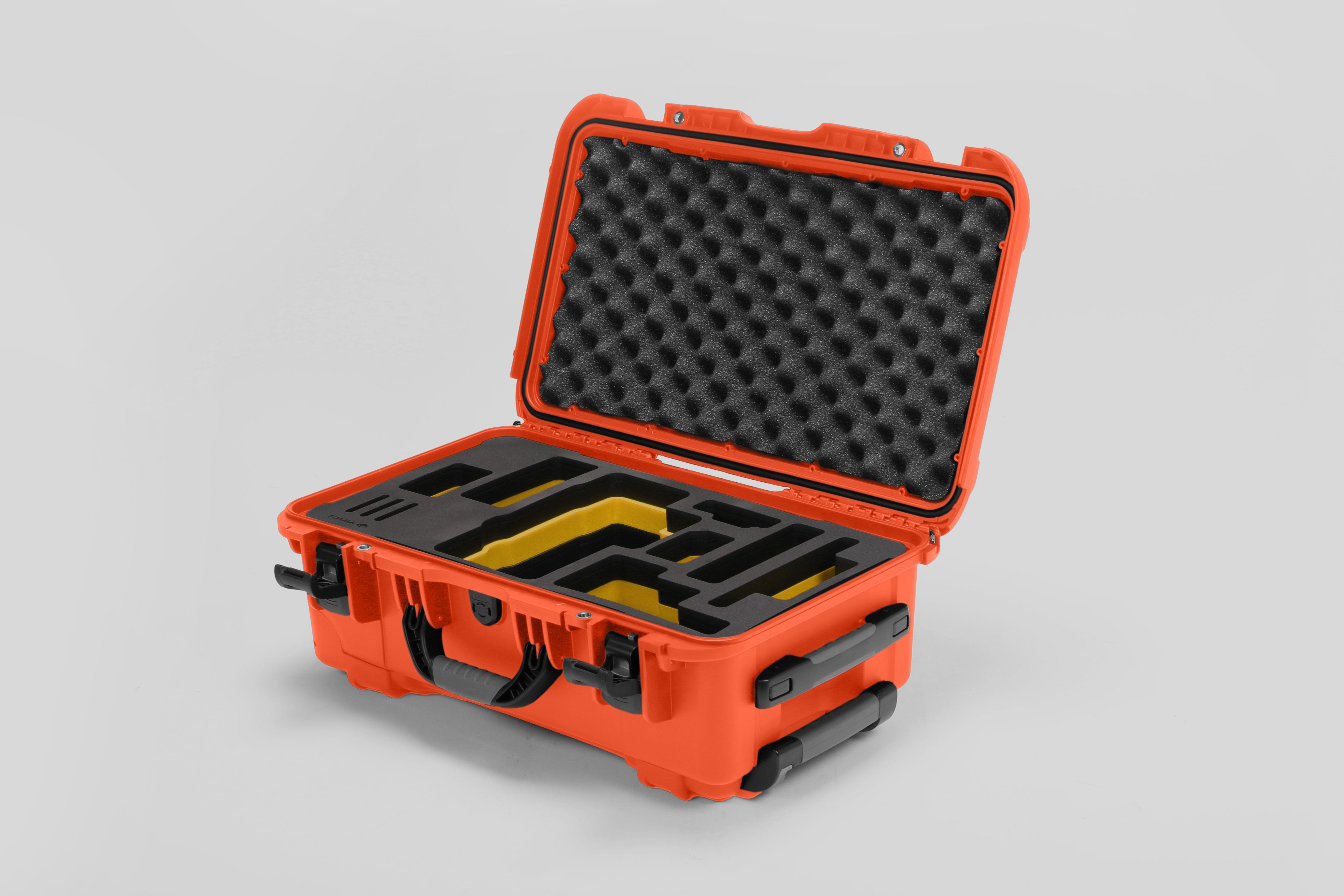 Angled view of Foama Orange Color Travel Case and Custom Foam Insert with Yellow Layer for RED Monstro