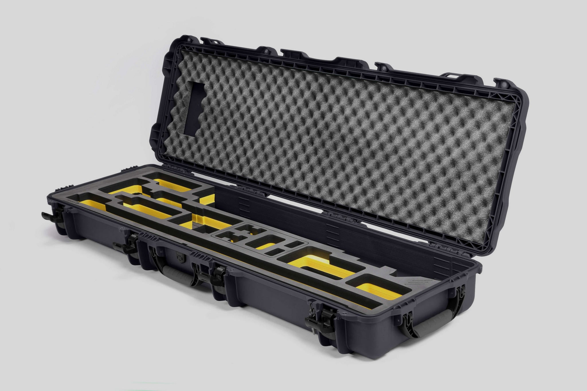 Angled view of Foama Fortified Graphite Color Hard Case and Custom Foam Insert with Yellow Layer for DJI D-RTK 2 Mobile Station