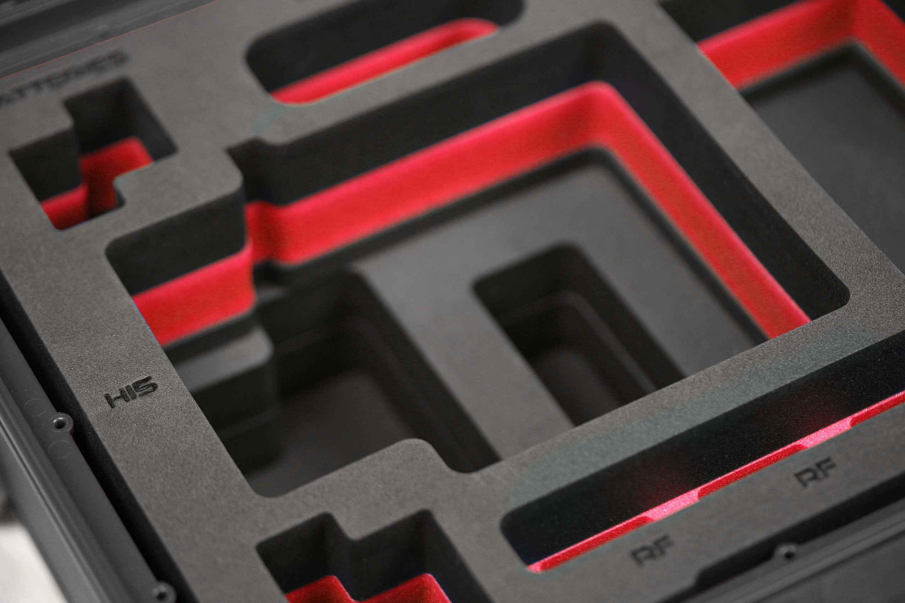Close view of Black Color ARRI HI-5 Carry-On Case with Red Layer Custom Foam Insert